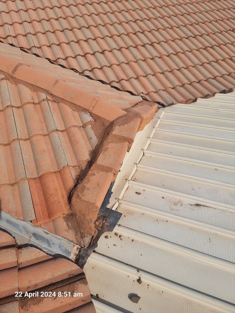 A Close Up of a Roof With Tiles and a Metal Roof — Stormguard Roofing In Maroochydore, QLD