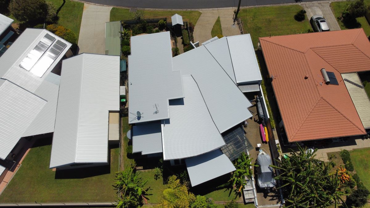 Two Roofers Working on a Roof Replacement — Stormguard Roofing In Caloundra West, QLD