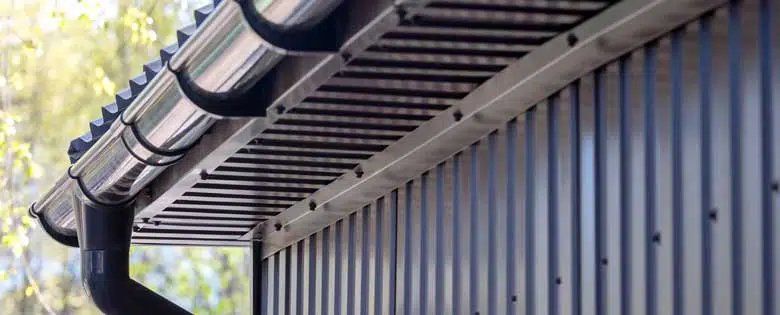 A Close Up of a Gutter on the Side of a Building — Stormguard Roofing In Caloundra West, QLD