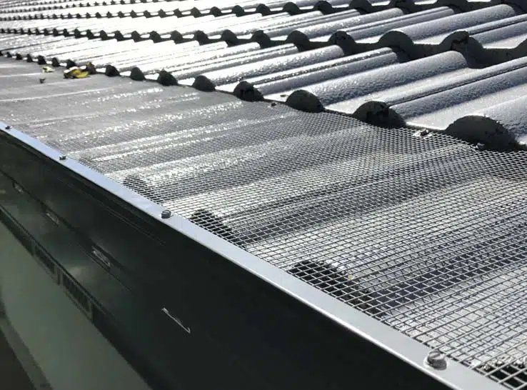 A Close Up of a Metal Gutter on a Roof — Stormguard Roofing In Caloundra West, QLD