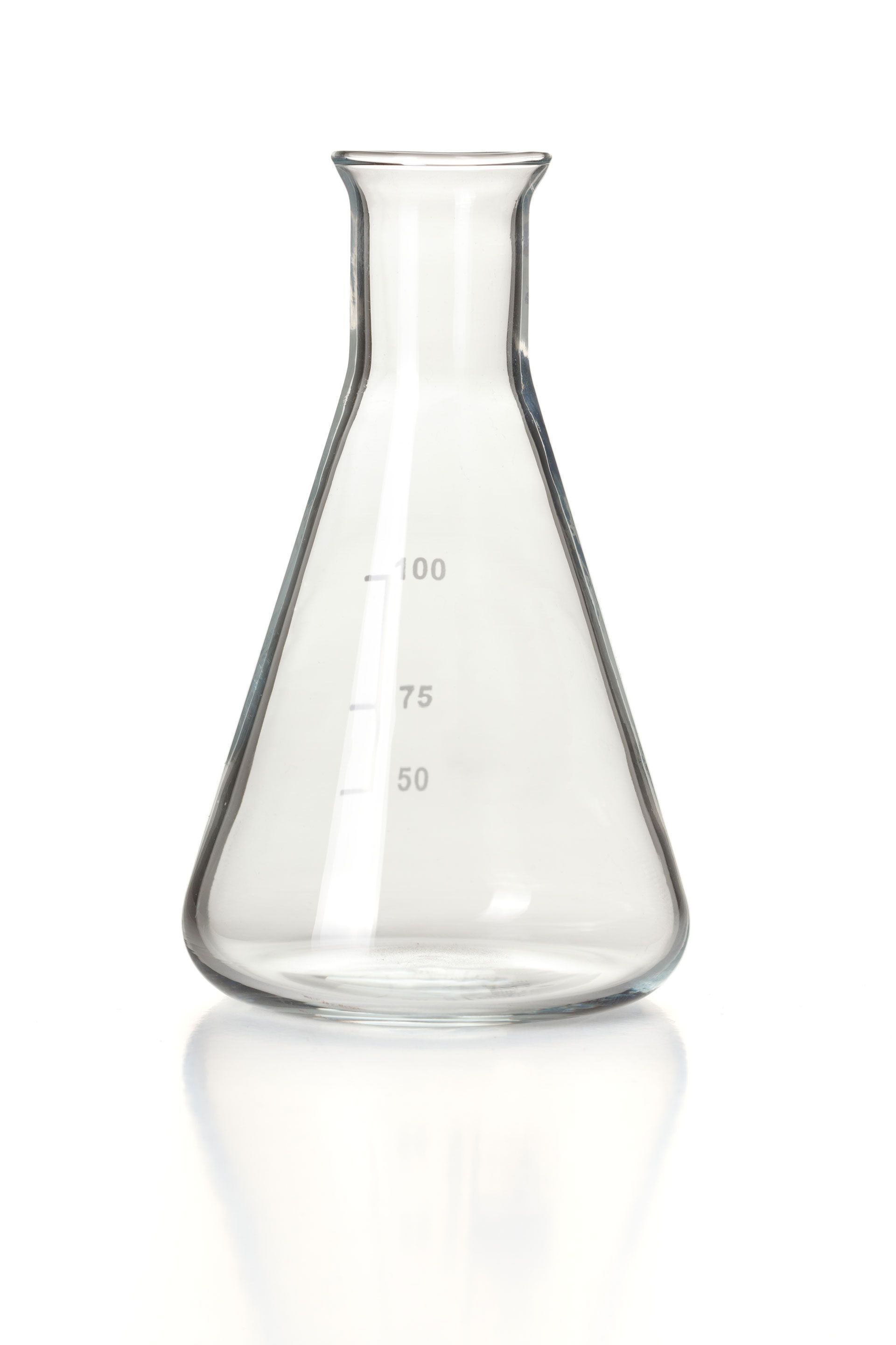 A clear glass beaker with measurements on it on a white background.