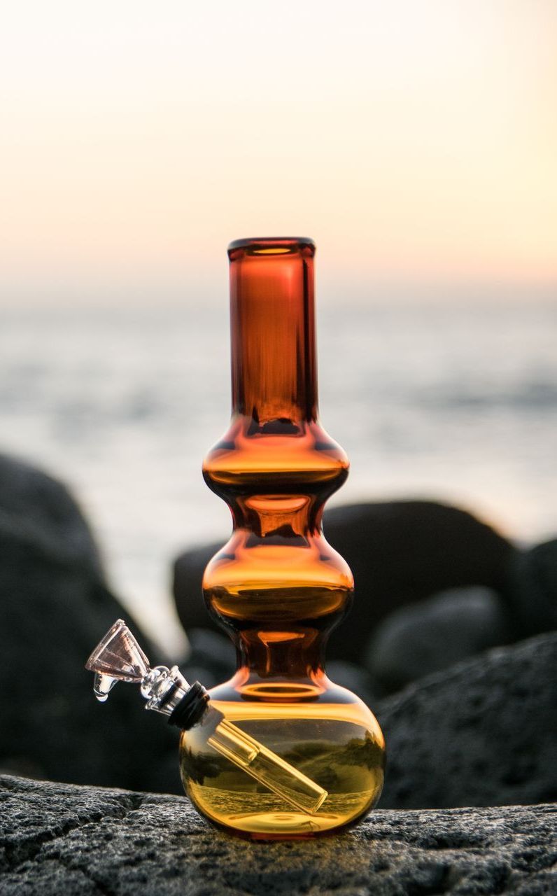 A beaker with measurements on it is sitting on a table.