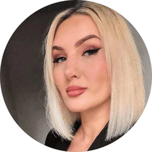 A woman with blonde hair is standing in a circle.