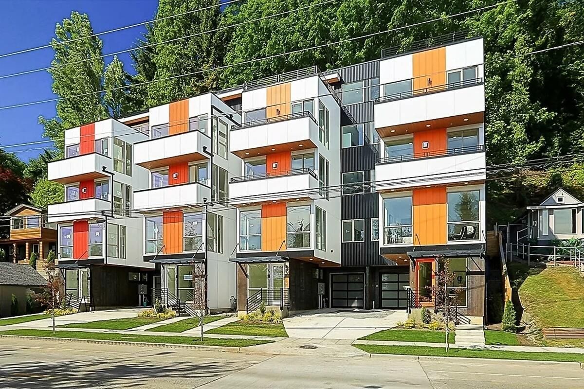 An artist 's impression of a row of apartment buildings
