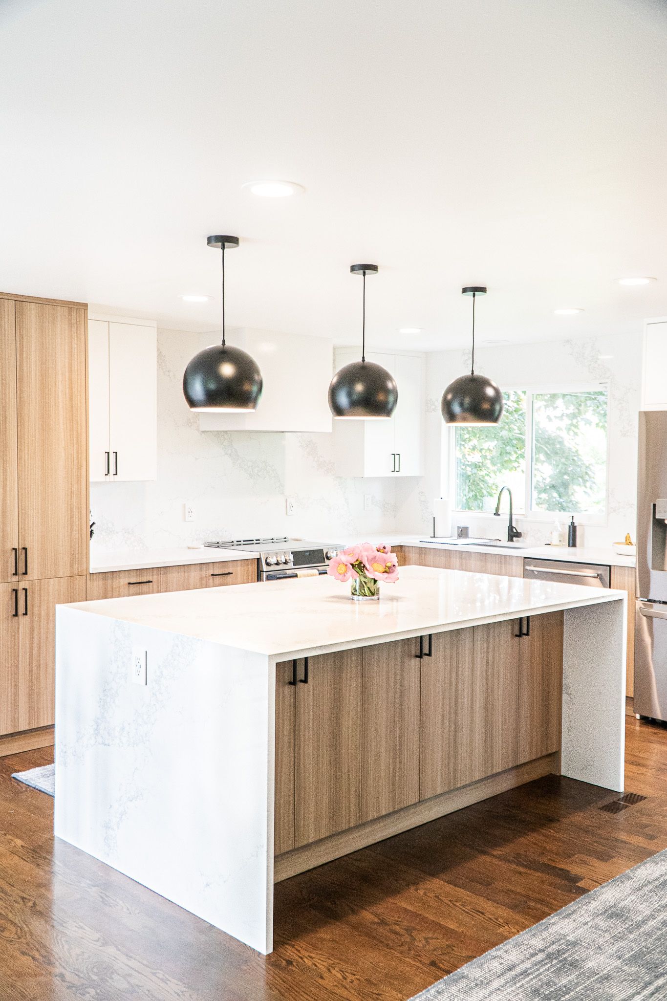 There is a large island in the middle of the kitchen.
