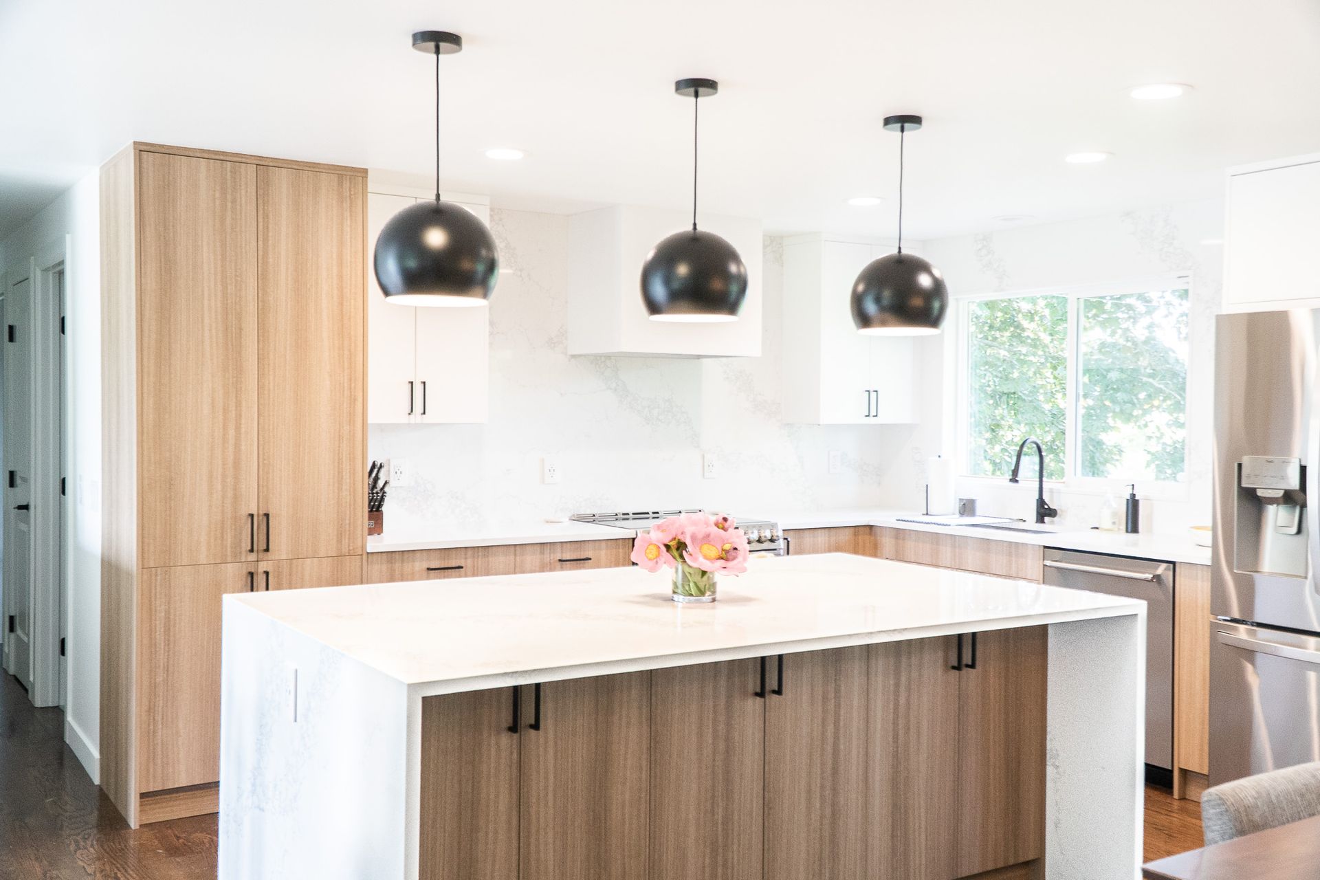 A kitchen with a large island in the middle of it.
