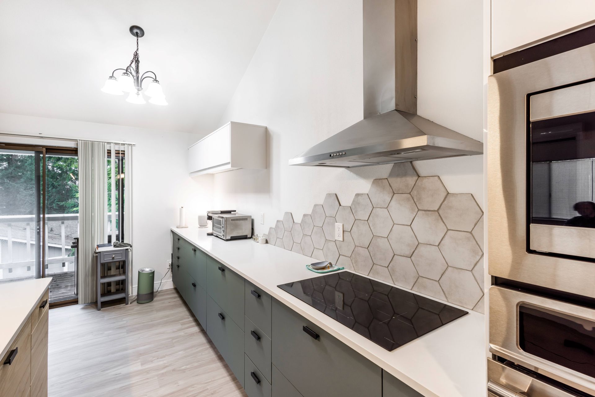 A kitchen with a stove top oven and a microwave.