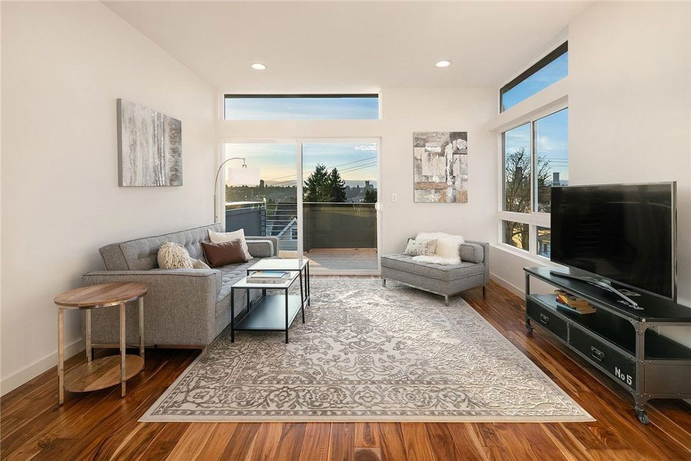 A living room with a couch and a flat screen tv