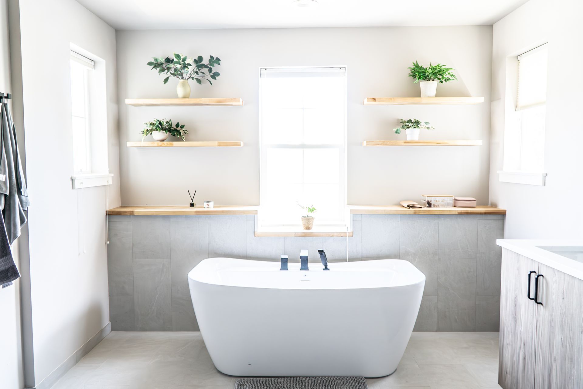There is a bathtub in the middle of the bathroom.
