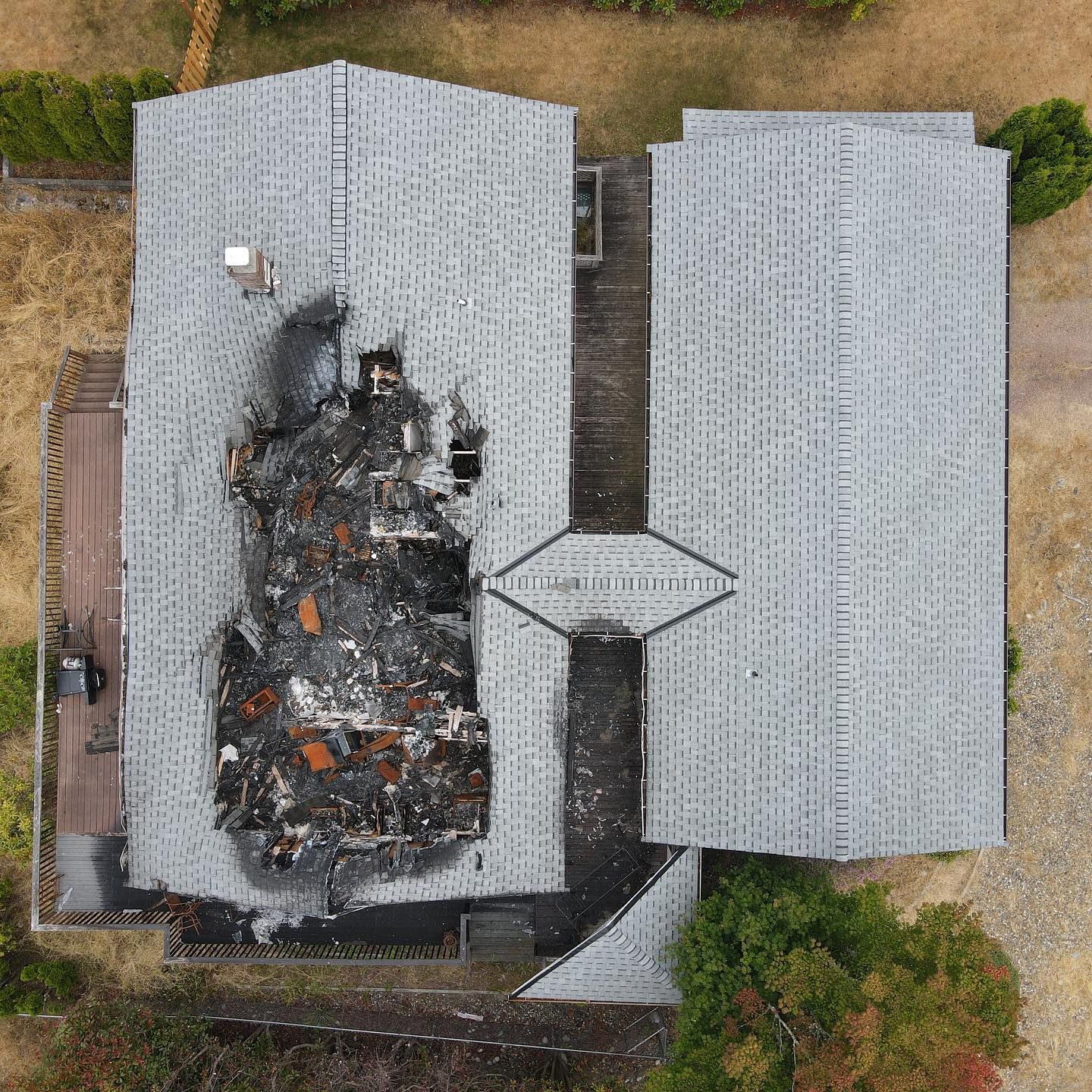 An aerial view of a house that has been damaged by fire