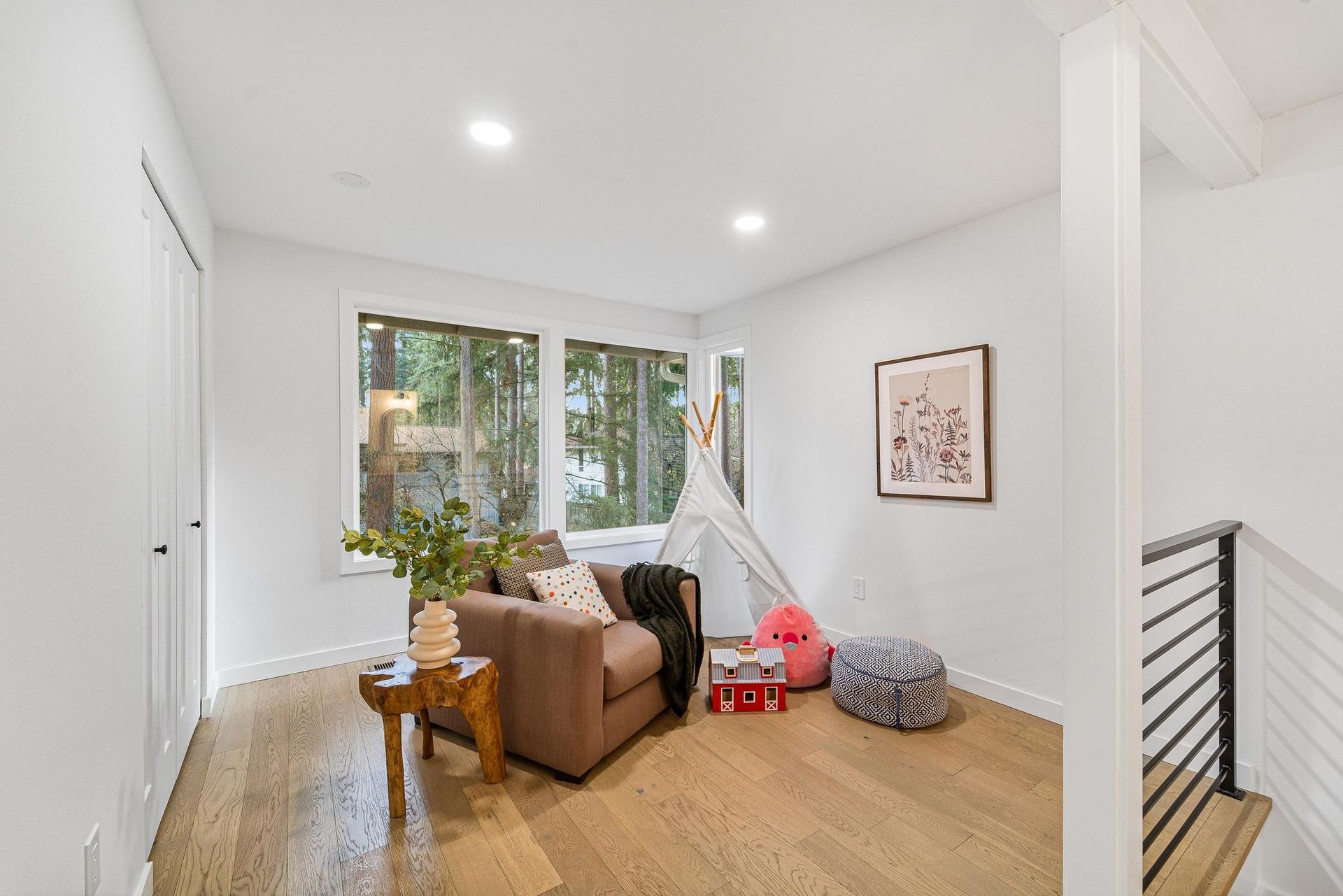 A living room with a couch , table , and teepee.