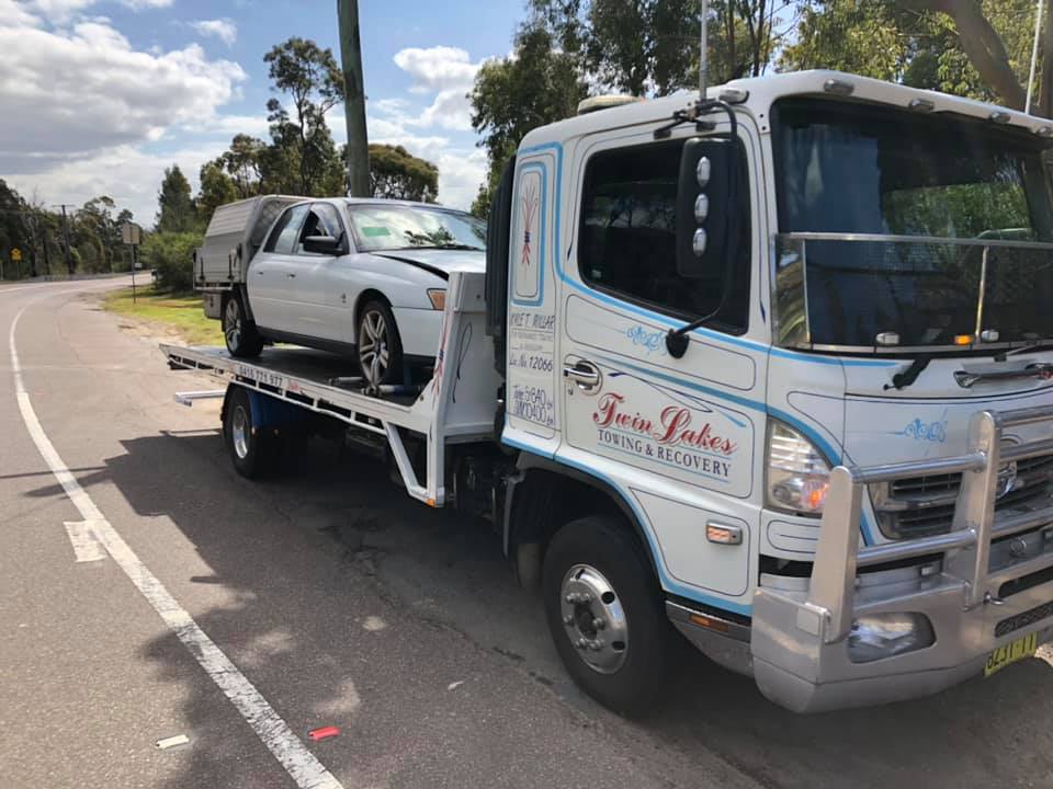 Car On Towing Truck — About Us in Hamlyn Terrace, NSW
