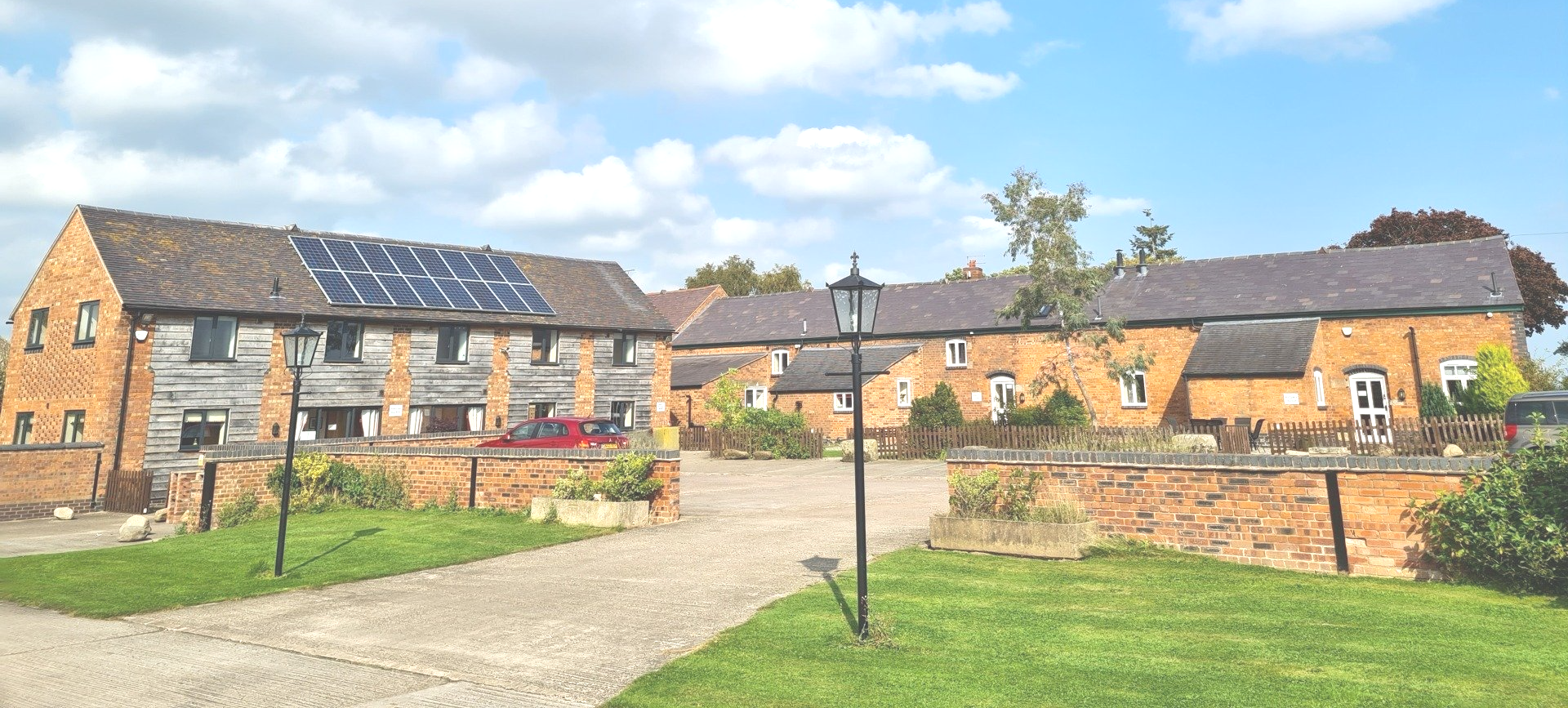 Entrance to Alkington Grange Barns, car park and cottages