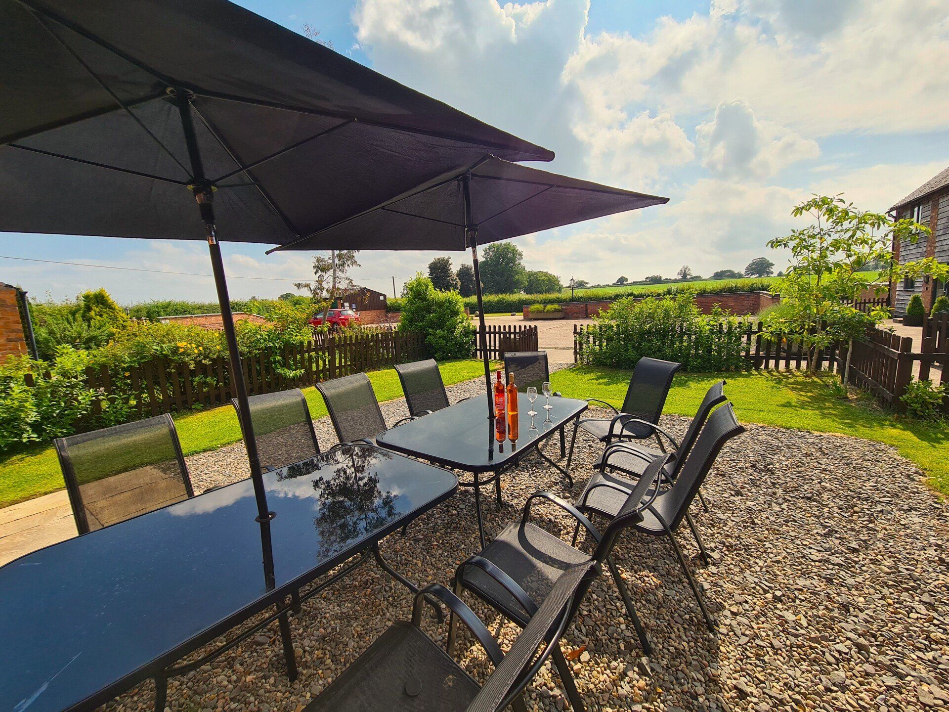 Patio with wine and glasses with countryside views