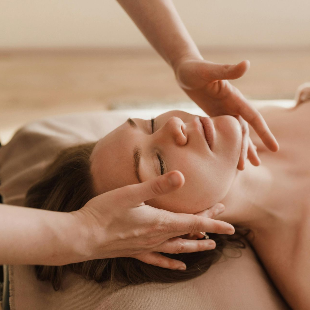 a woman's face being massaged