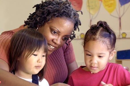 Babysitting — Preschool Teacher and Child Giving Lesson in Lake Charles, LA