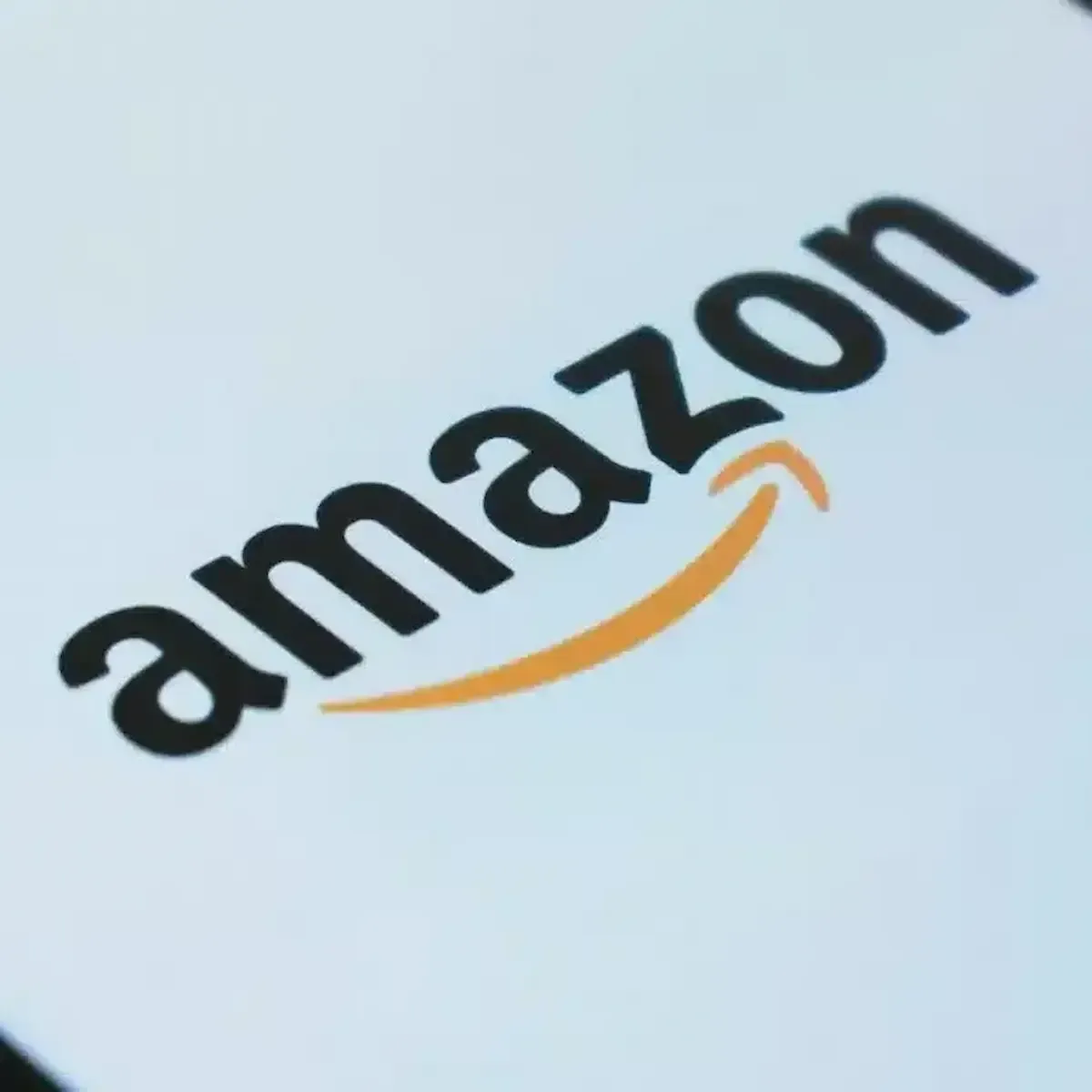 A close-up shot of the Amazon logo displayed on a phone.