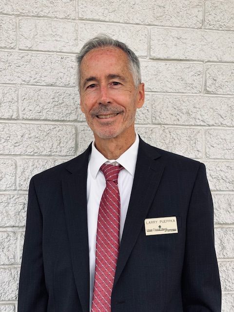 Silhouette of a man in profile, looking to the right.