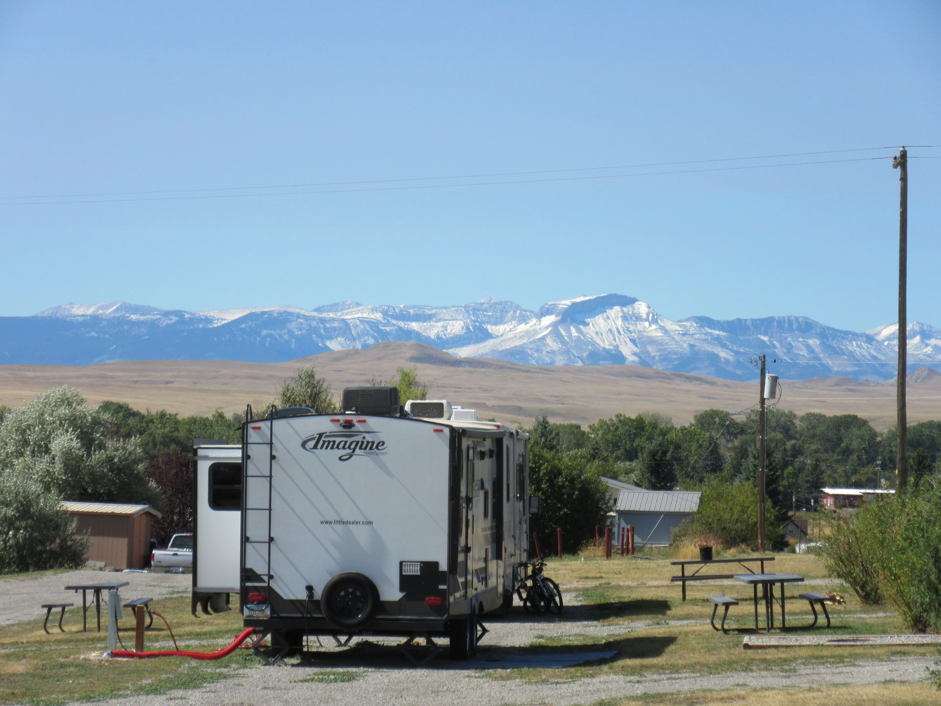 RV parked at campsite with mountain view.