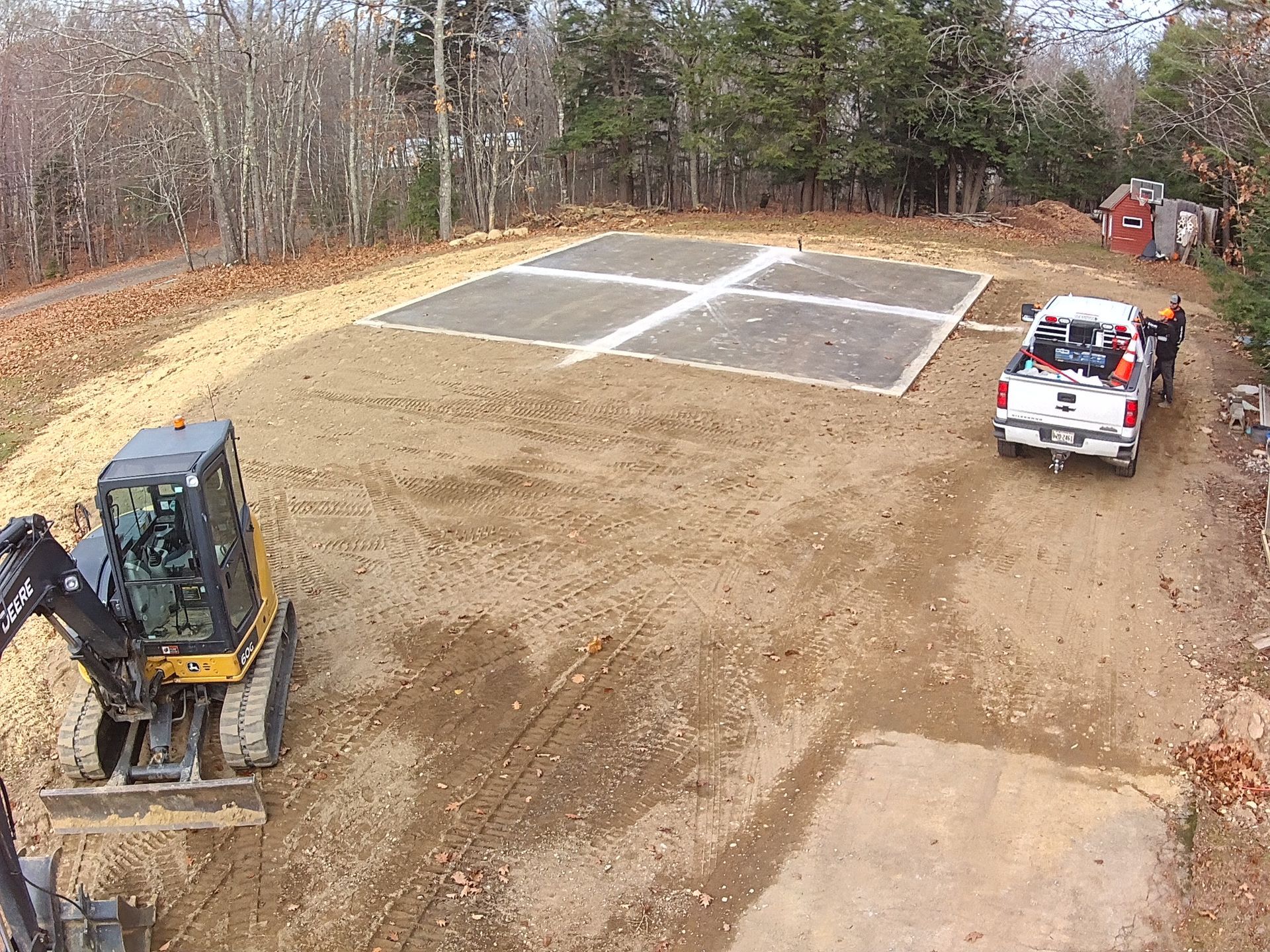 An aerial view of a construction site with a bulldozer and a truck.