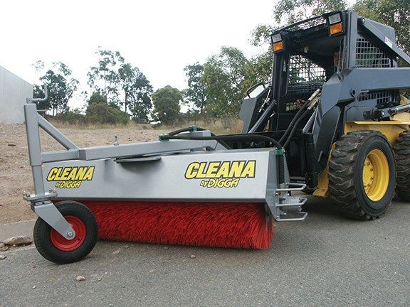 A cleana tractor is parked on the side of the road