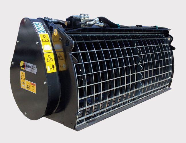 A large metal bucket with warning signs on it