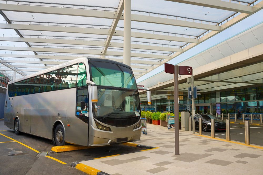 Bus On A Parking Lot At Airport Terminal — Shuttle Buses from Hervey Bay in Dundowran Beach, QLD