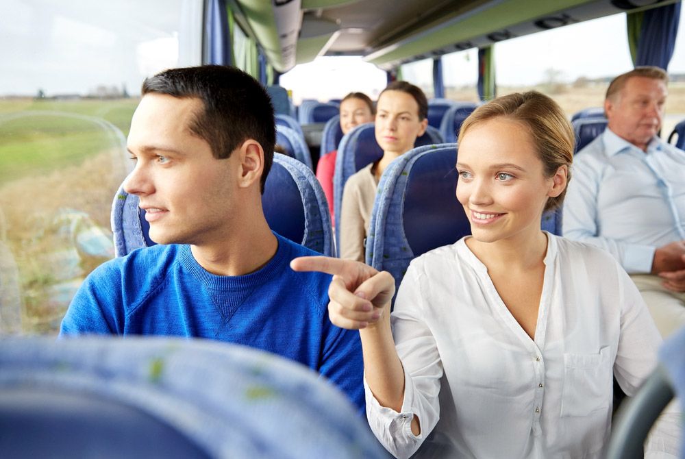 Happy Couple Or Passengers In Shuttle Bus — Shuttle Buses from Hervey Bay in Dundowran Beach, QLD