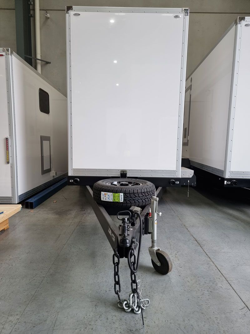 A White Trailer is Parked in a Warehouse — Ecotreat Solutions NT in Katherine, NT