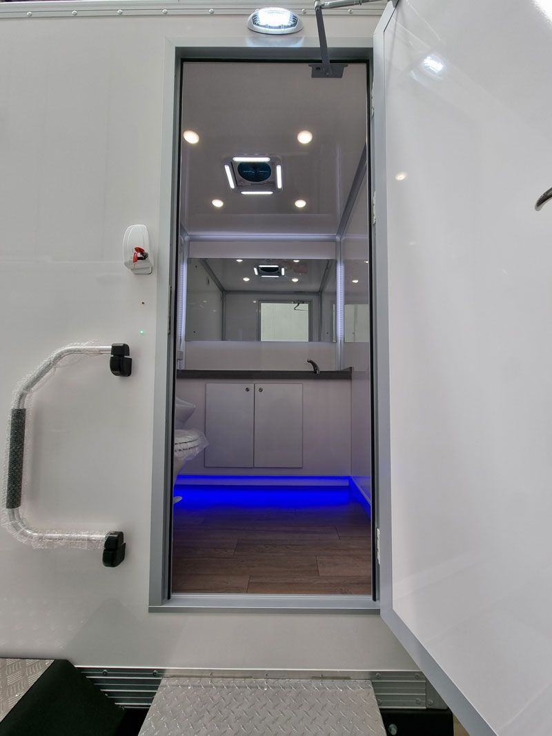 Compact Portable Bathroom With Illuminating Blue Light — Ecotreat Solutions NT in Winnellie, NT