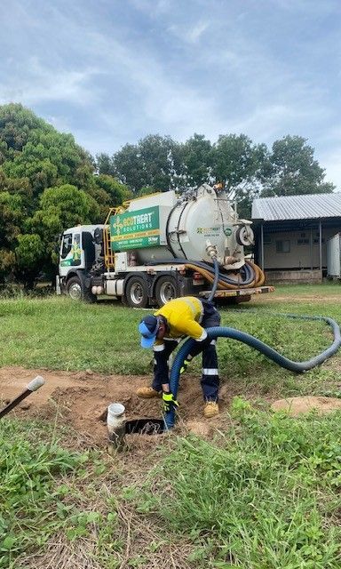 Man Working in the Field with Vacuum Truck — Portable Toilets in Winnellie, NT