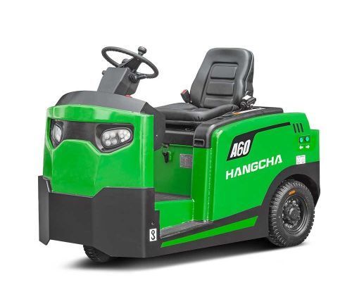 Green Hangcha AG0 electric tugger. Side view, operator seat, black tires, black and green body.