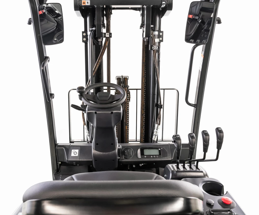 Forklift cab interior, featuring a steering wheel, control levers, and gauges.