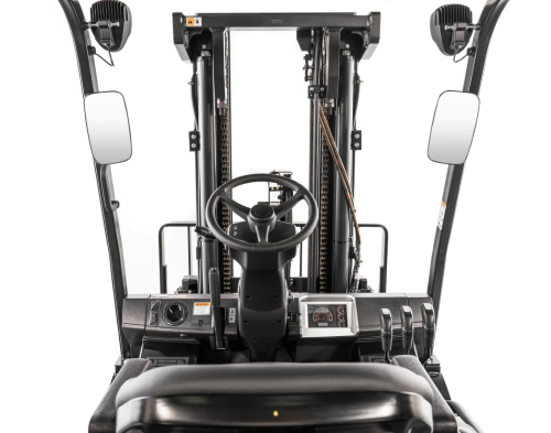 Forklift's interior view: steering wheel, mirrors, and instrument panel.