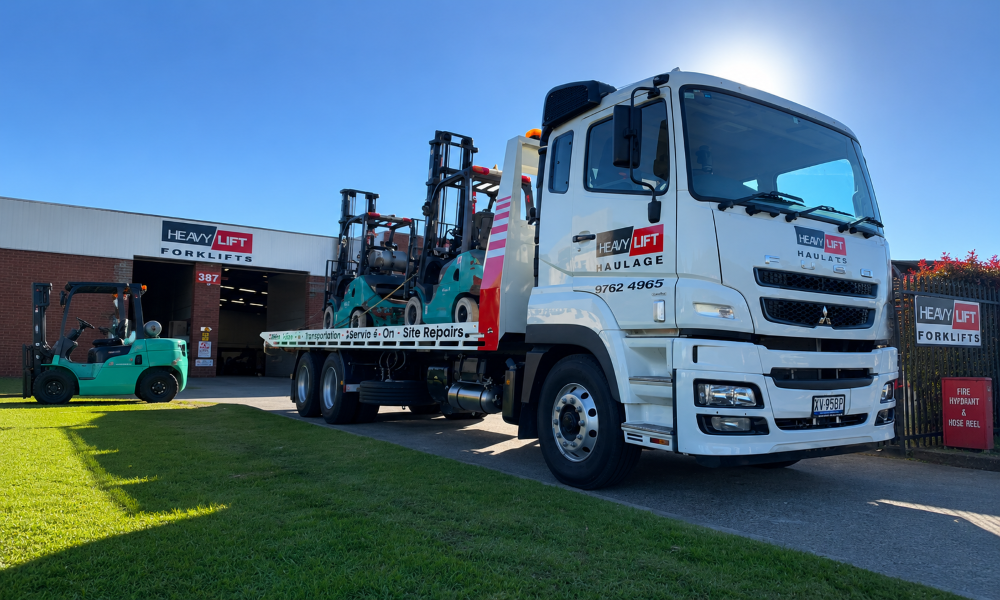 forklift loaded on a truck prepared for delivery