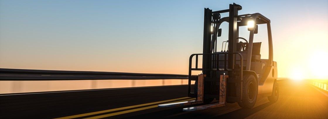 Forklift driving down a road at sunset Forklift Load Centre Distance Explained