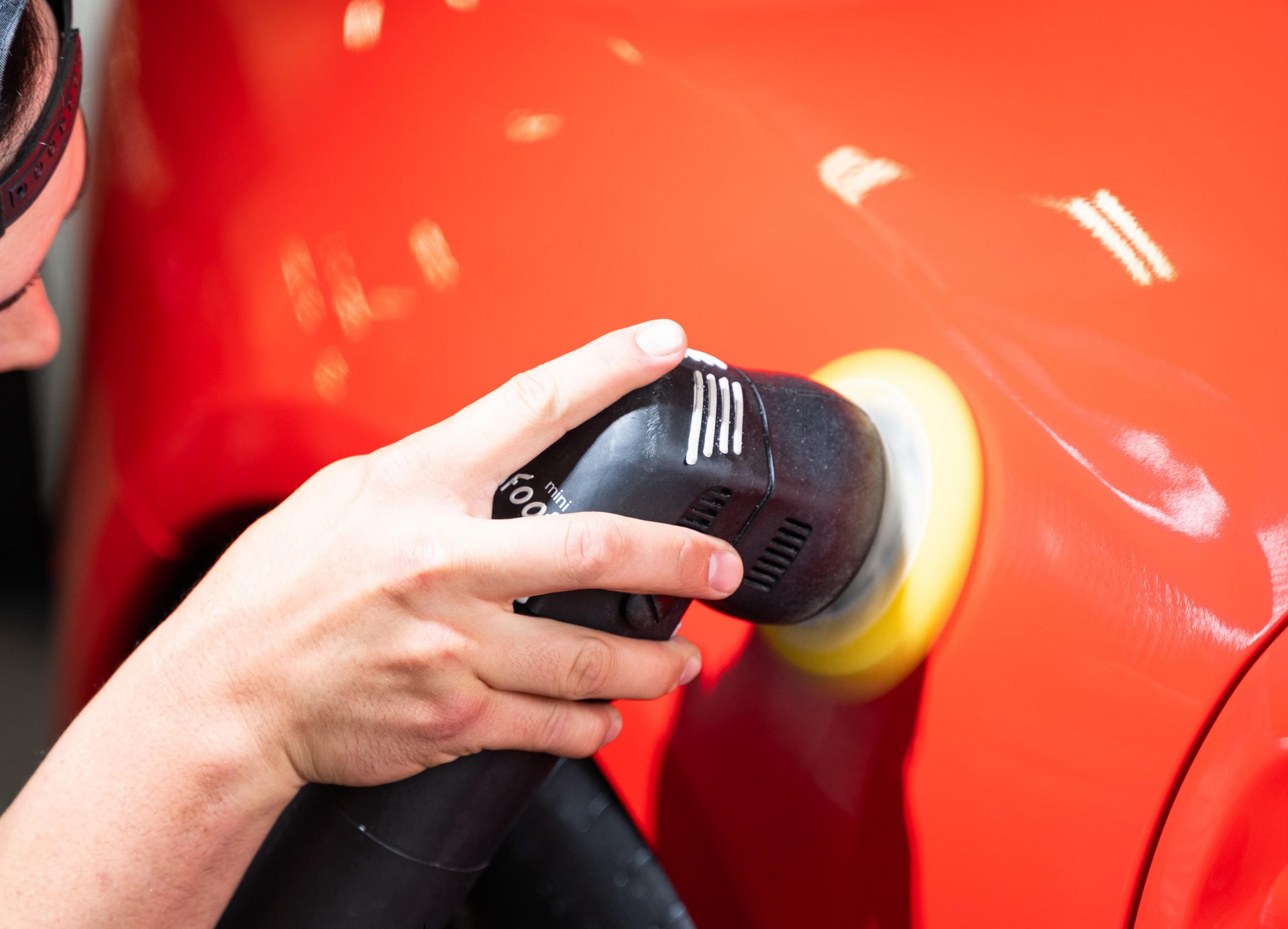 paint correction service on a red car in la jolla, ca