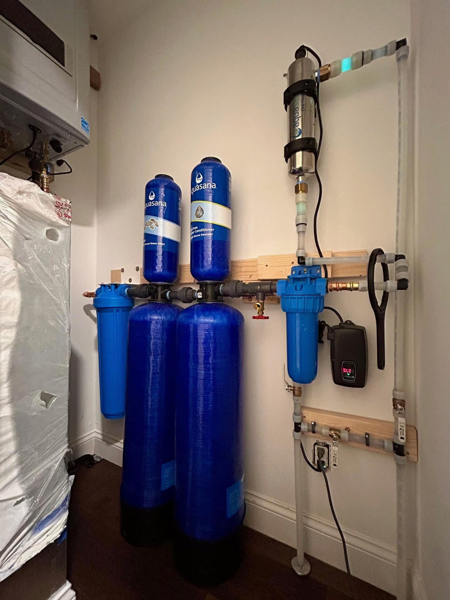 Two blue tanks are sitting next to each other in a room.