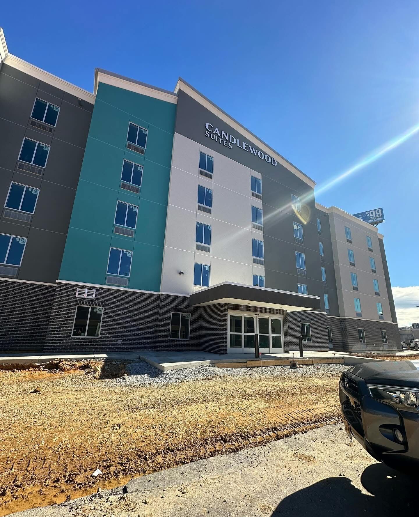 A large building with a car parked in front of it