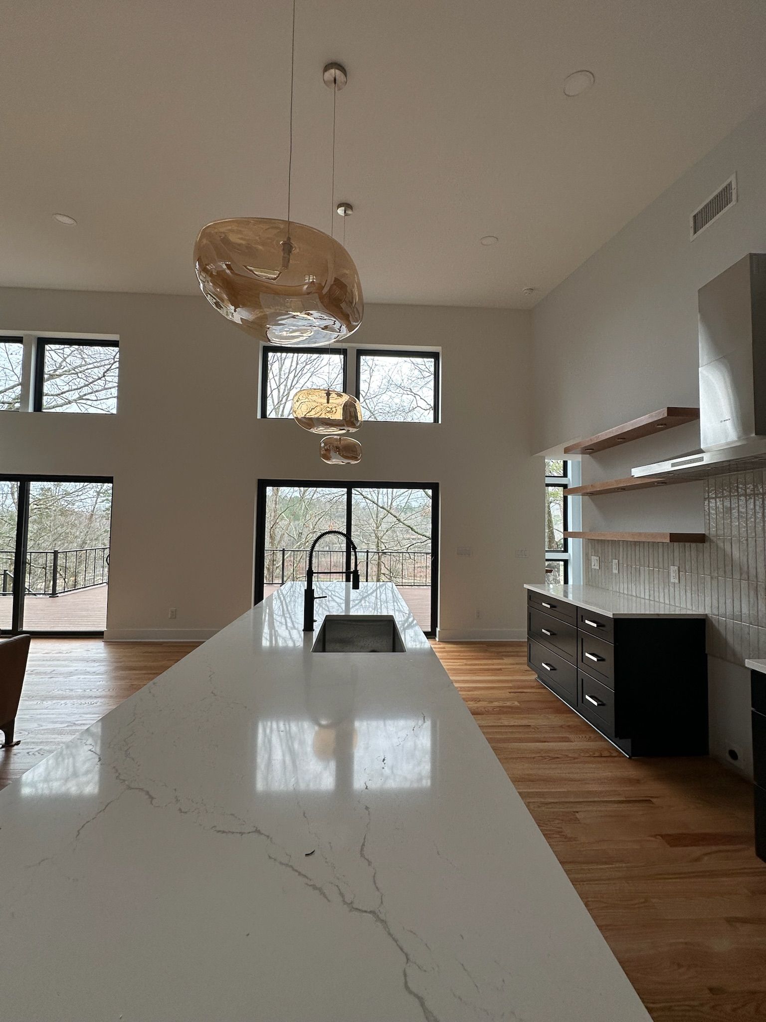 A kitchen with a large island and a sink