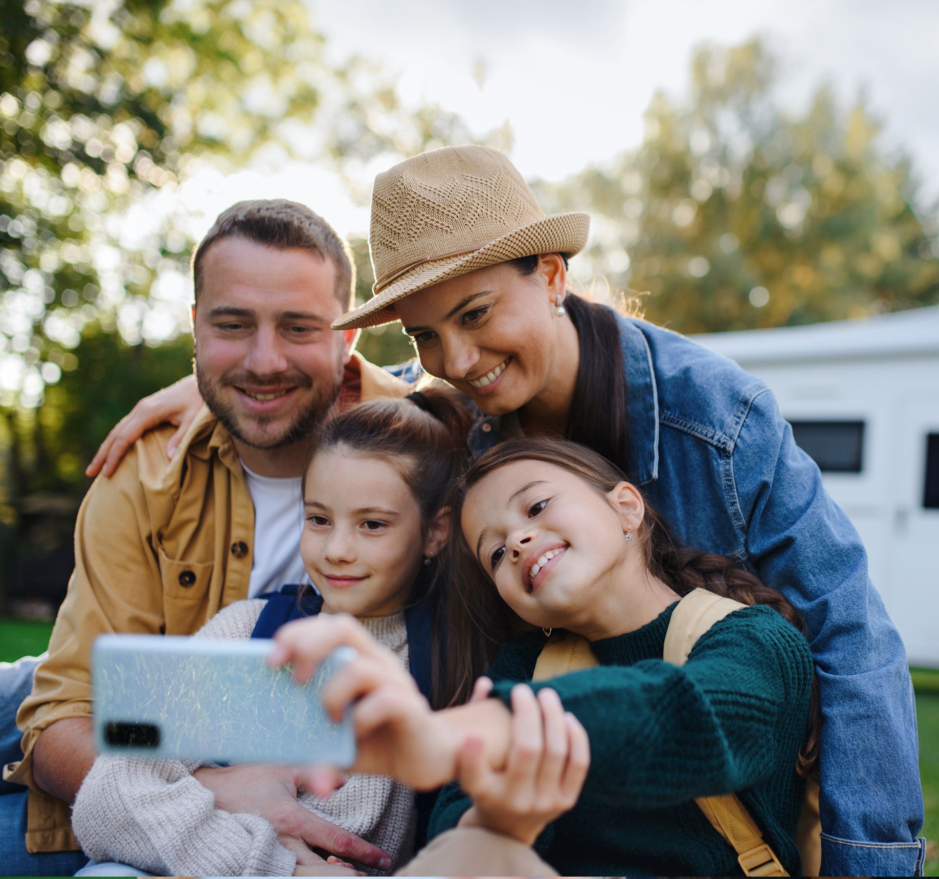 A man is standing next to a boat that says ' oasis ' on it