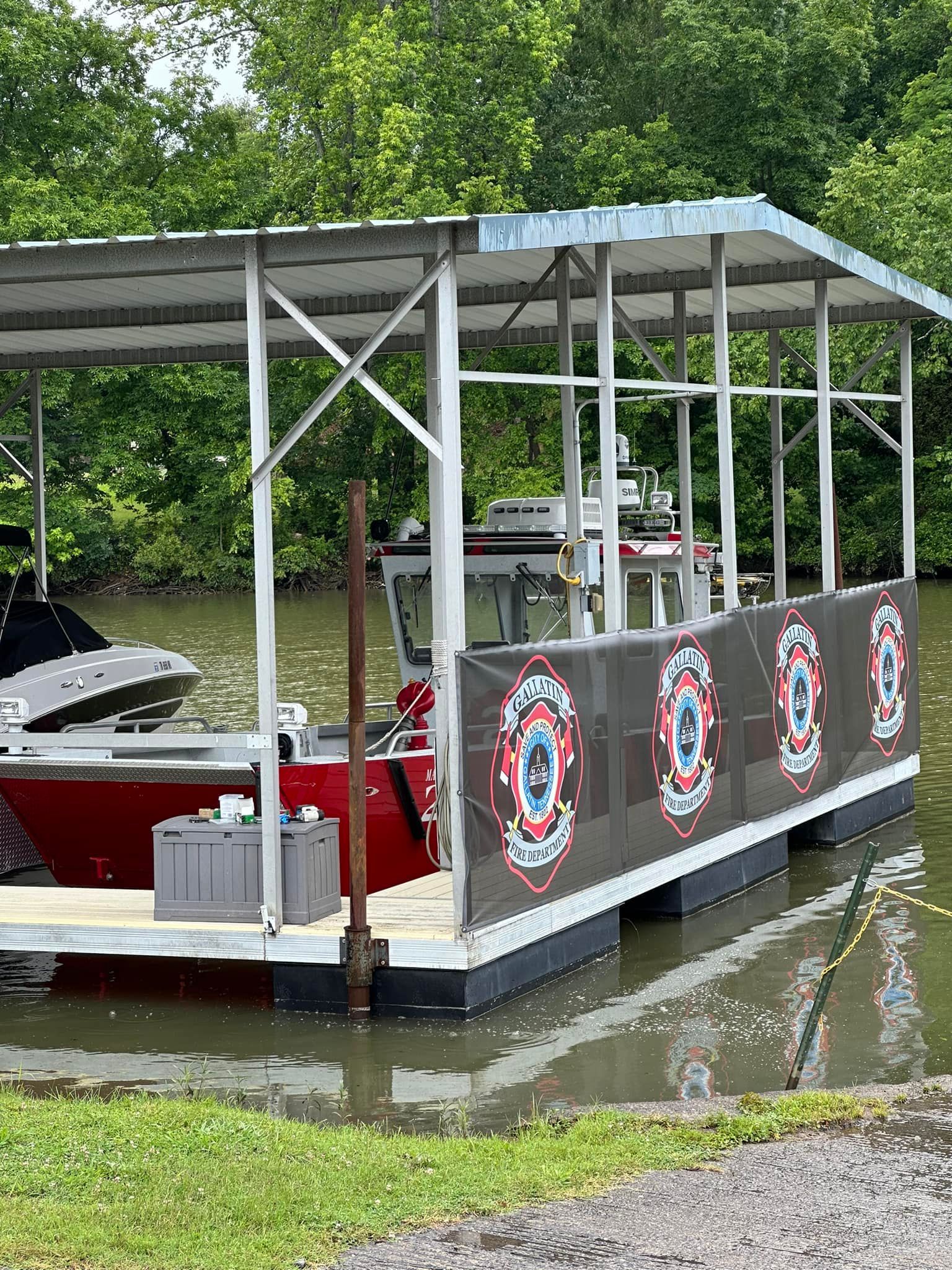 A boat is docked at a dock in the water.