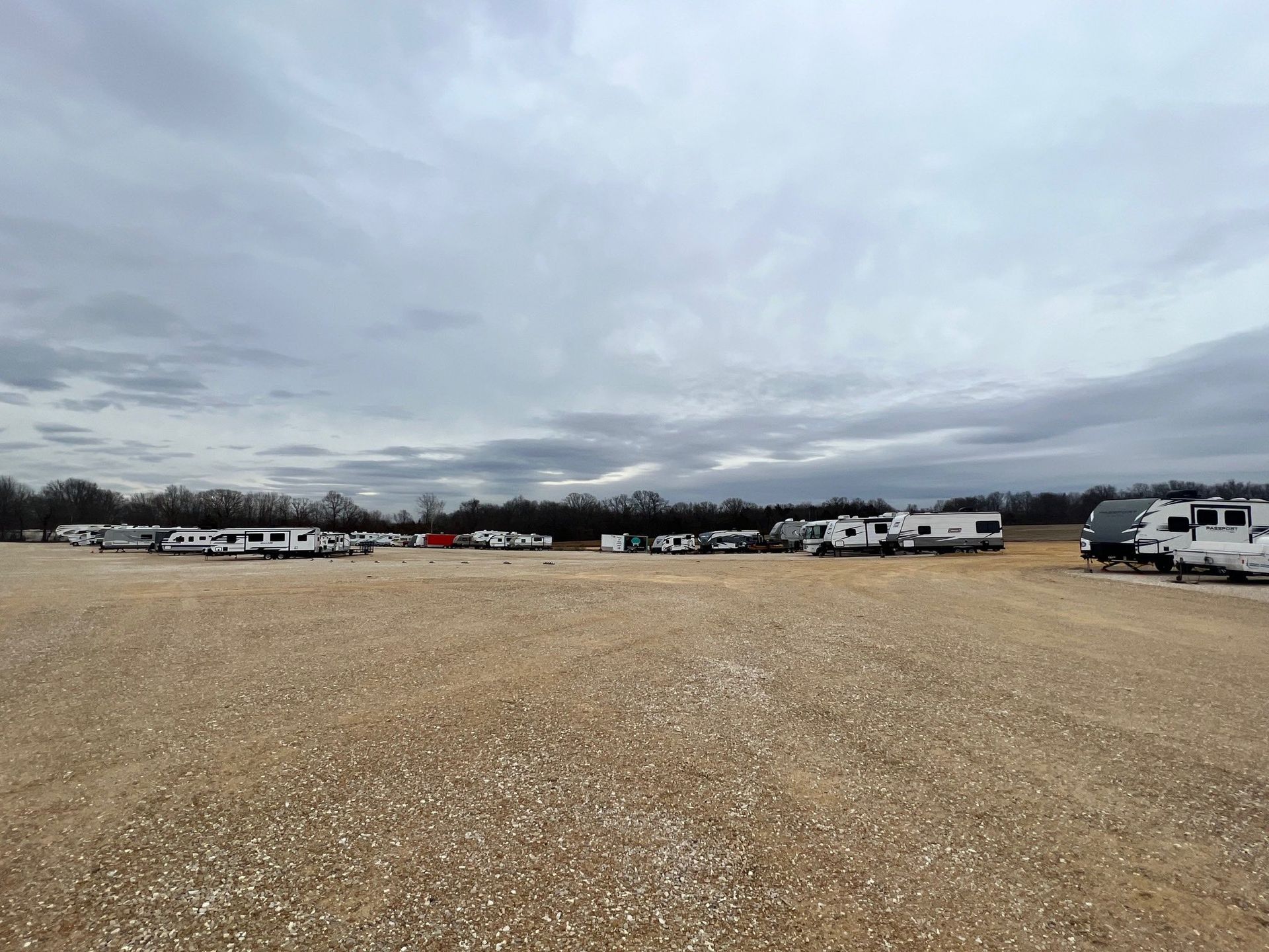 RVs parked on gravel lot