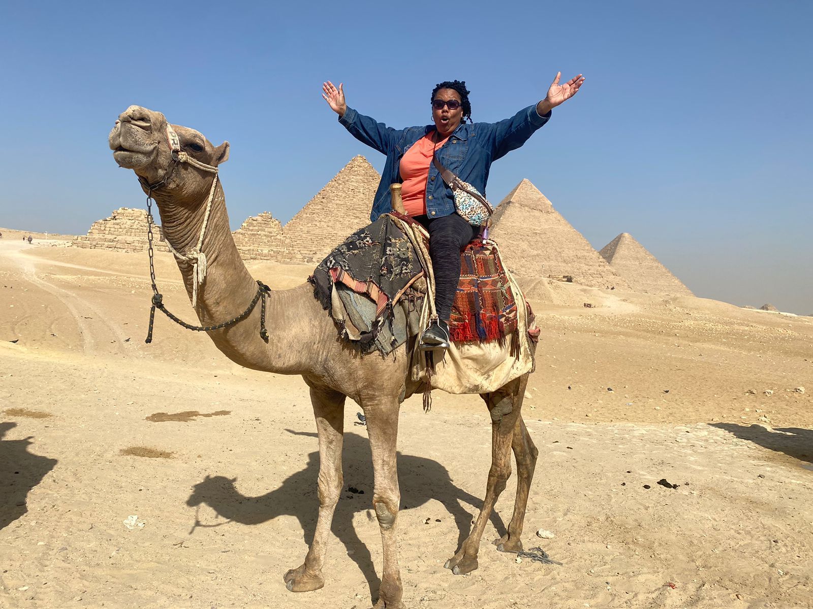 Black Travelers International on a camel in Cairo