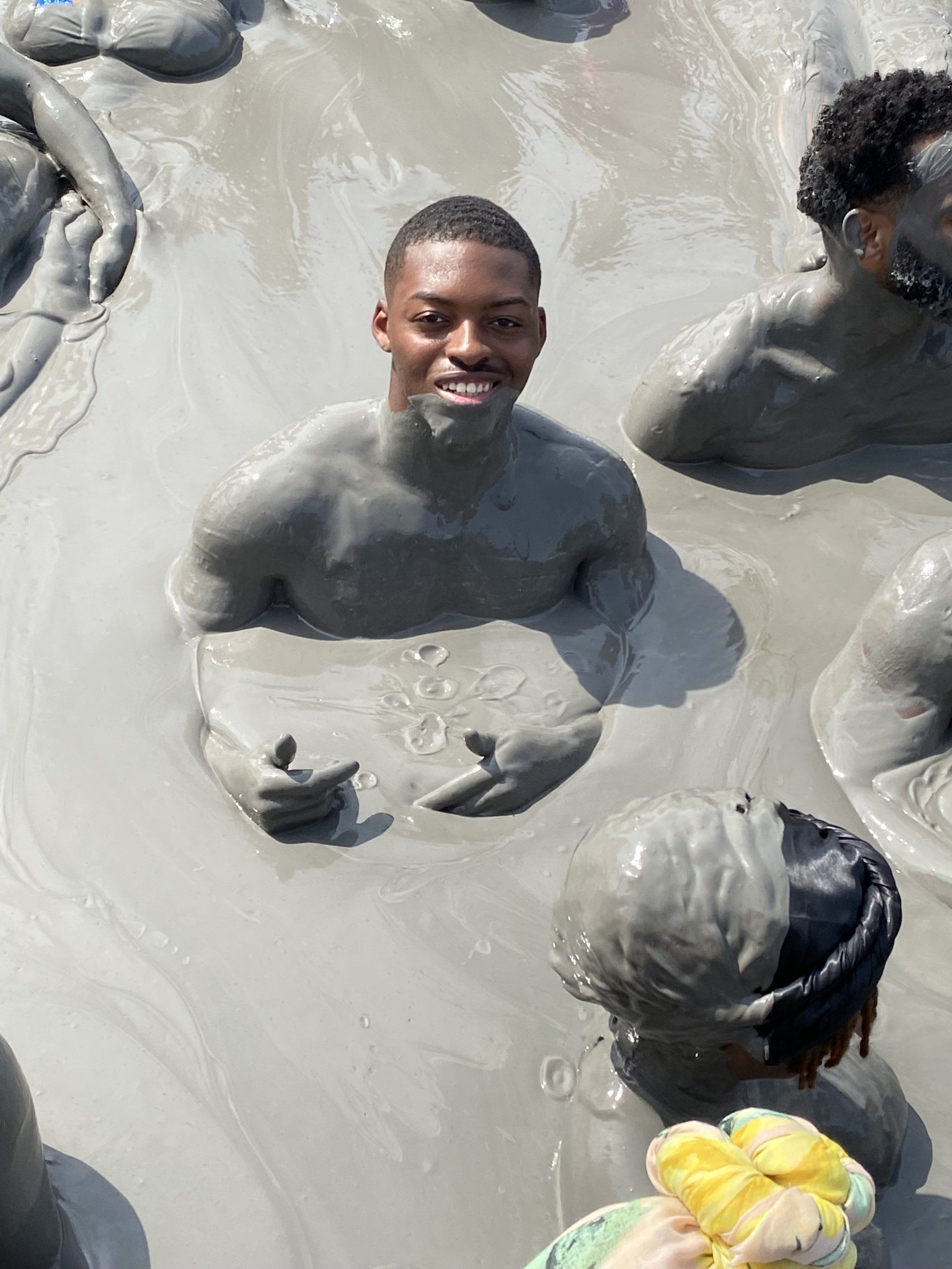 Black Traveler in Mud Volcano in Cartagena