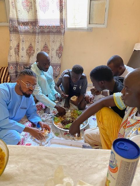 Enjoying a traditional dinner in Senegal, Africa