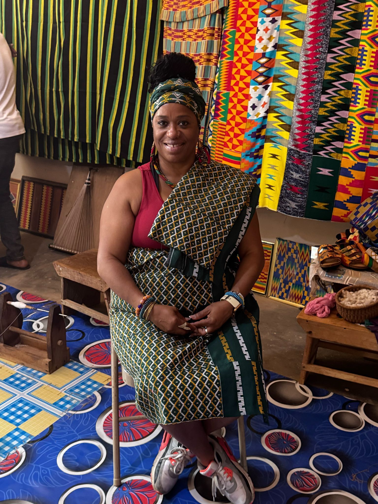 black travel group enjoy a shopping for Kente cloth in Ghana