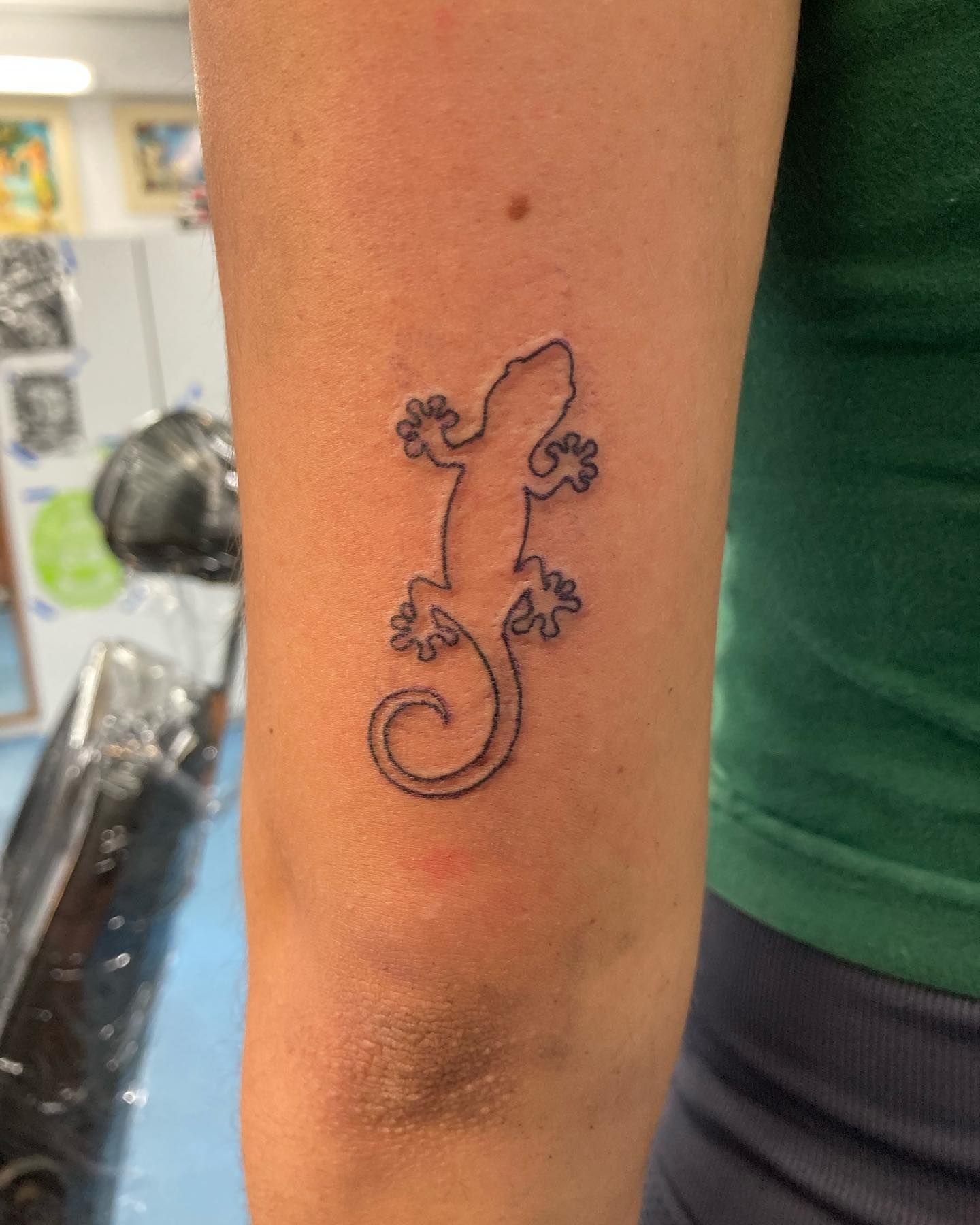 A Small Tattoo of a Lizard on a Person's Arm — La Bomba Loca Tattoo in Cairns City, QLD