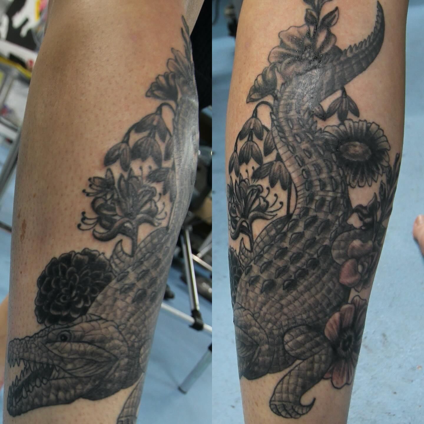 A Person Has a Tattoo of a Crocodile and Flowers on Their Leg — La Bomba Loca Tattoo in Cairns City, QLD