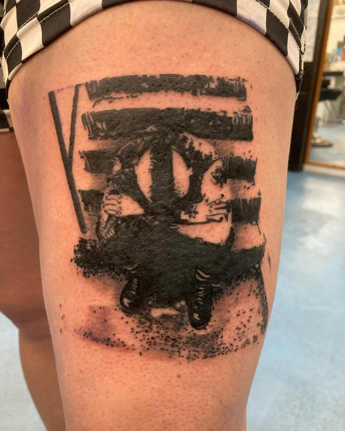 A Black and White Tattoo on a Person's Leg — La Bomba Loca Tattoo in Edmonton, QLD